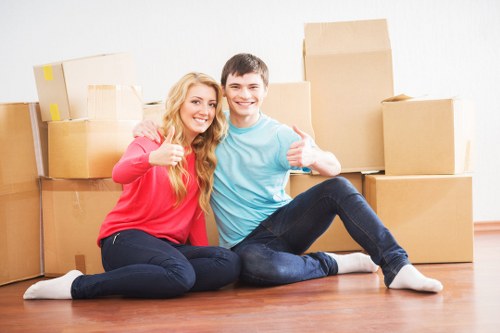 Commercial relocation team preparing office furniture for transport